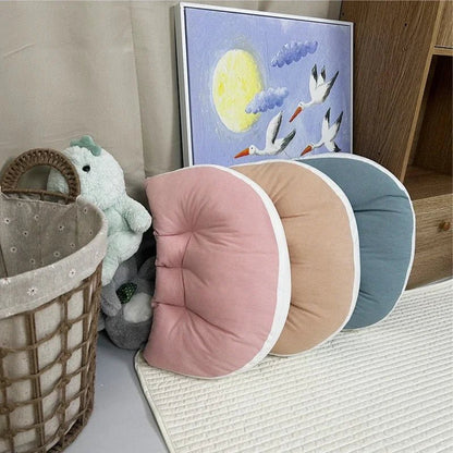 Coussin bébé | Coton Respirant TrésorBébé placé à côté d'un tableau