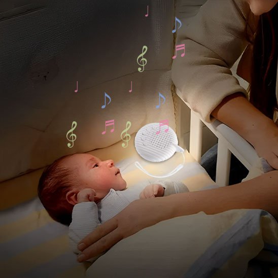 Veilleuse bruit blanc | DouxSommeil placée dans  le berceau de bébé
